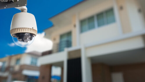 Cctv,Camera,With,House,In,Background