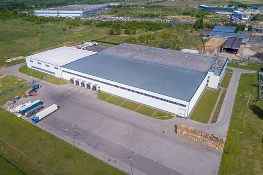 Aerial,View,Warehouse,Building,On,A,Summer,Day