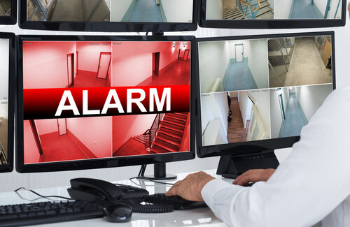 monitoring screen with security staff